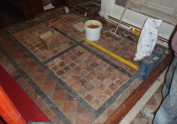 Sandridge church, tiles being re-laid, including replacements